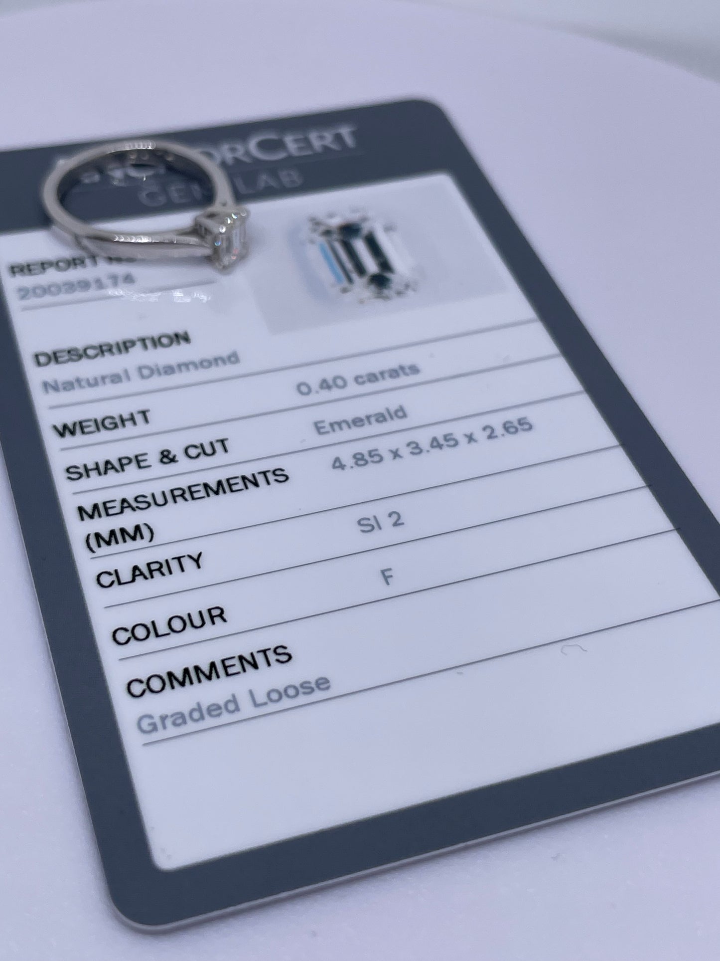 0.4ct emerald cut diamond ring